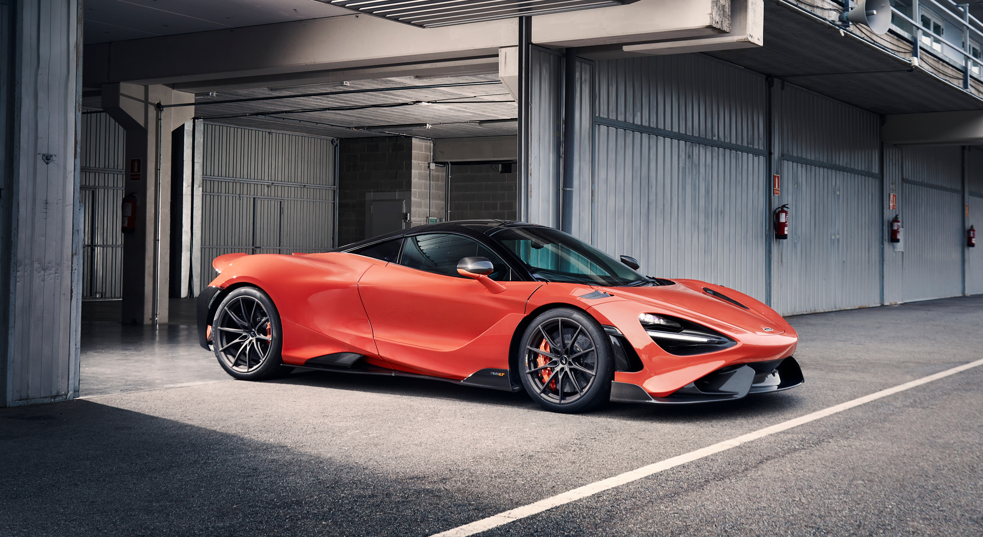 Orange McLaren 765LT at a racetrack in McLaren photography