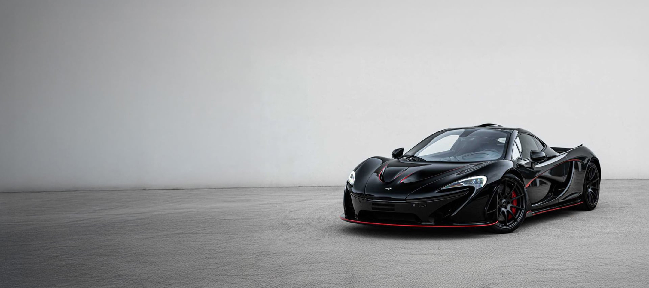 Black McLaren P1 with red detailing in official McLaren photography