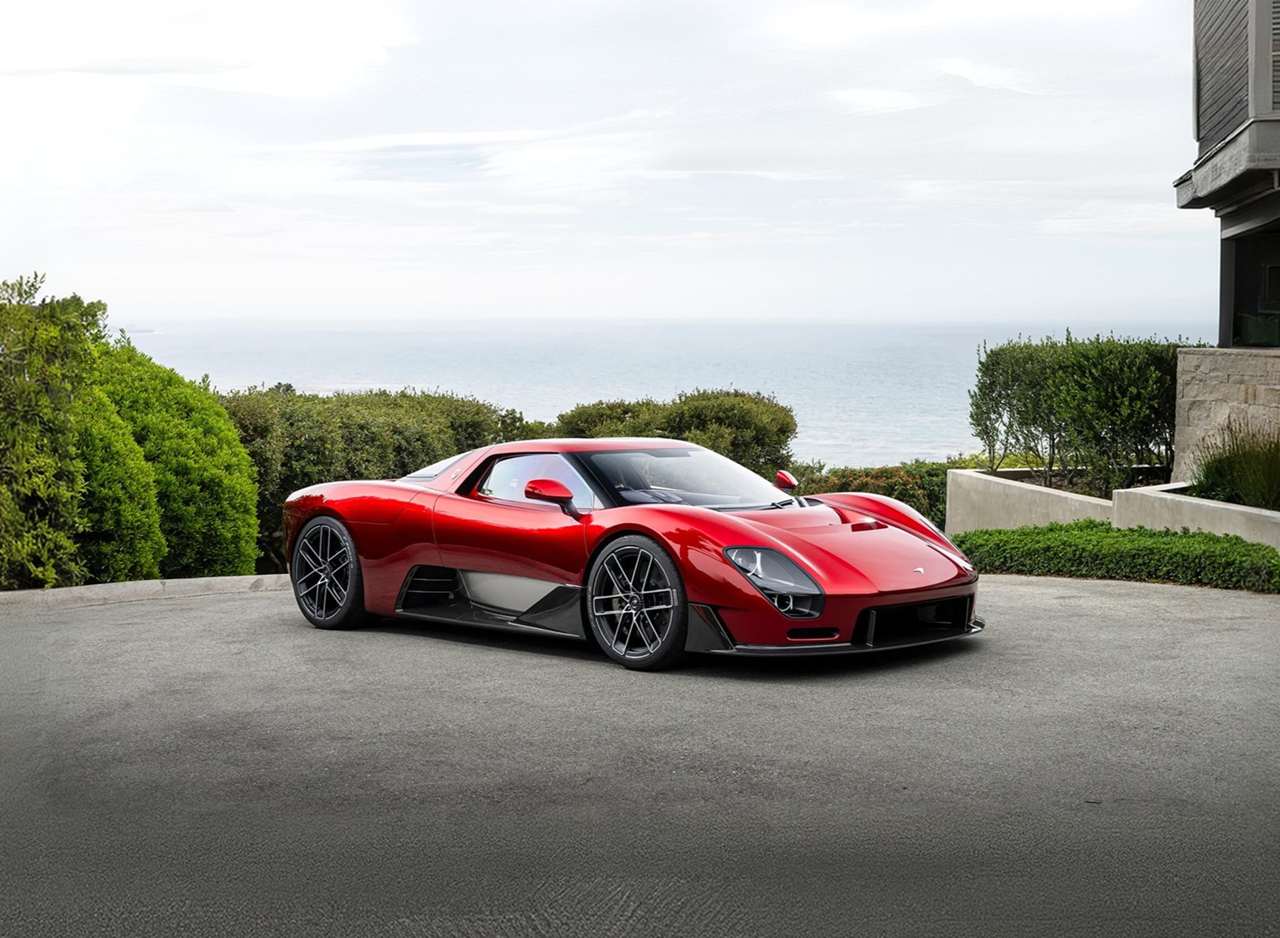 McLaren McL 6GT concept in heritage-inspired metallic red, full exterior view